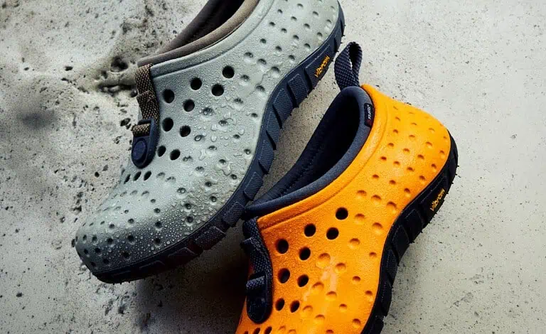 Outdoor Insight waterproof slip-on shoes in grey and orange for outdoor activities.