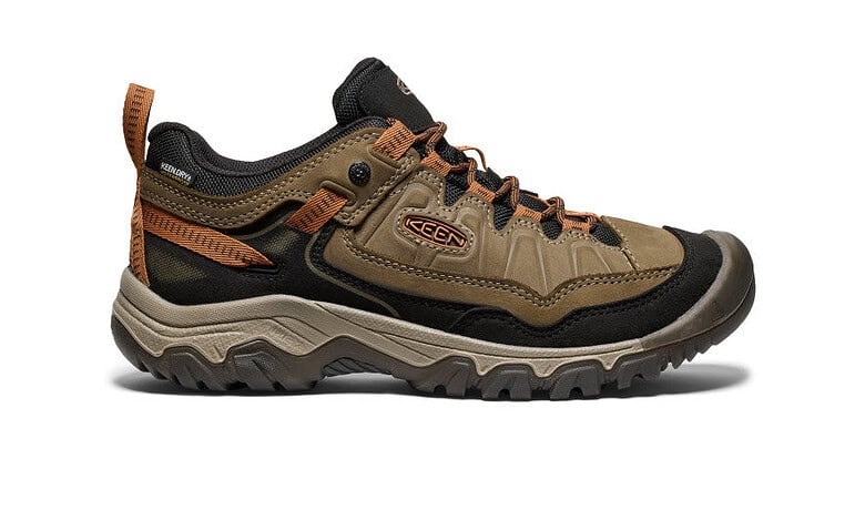 Men's waterproof hiking shoe with rugged sole and supportive design.