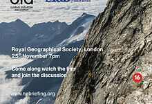Climber on a rocky mountain slope during a climate crisis briefing in the UK.