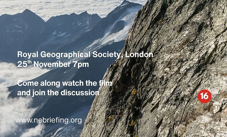 Climber on a rocky mountain slope during a climate crisis briefing in the UK.