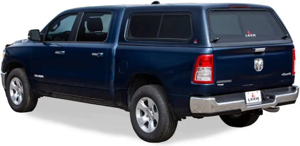 Protective blue truck bed bumper guard on a RAM pickup, designed for durability and vehicle safety.