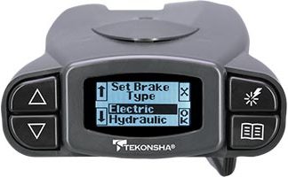 A close-up of a Tekonsha brake controller with a digital display showing settings.
