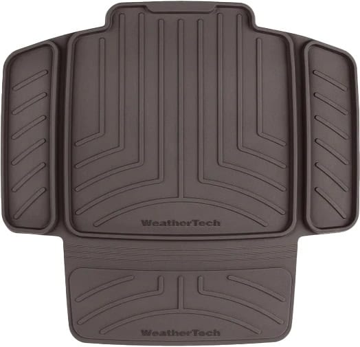 A cocoa brown WeatherTech 81CSP01CO child car seat protector with a ribbed pattern is shown. The protector includes side flaps and the WeatherTech logo is visible.