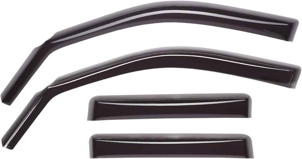 Four dark, glossy WeatherTech window deflectors are arranged on a white background. Two longer, curved deflectors are positioned at the top, likely for the front windows, while two shorter, rectangular deflectors are placed below, presumably for the rear windows.