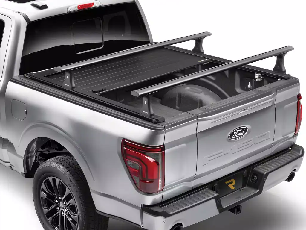 This image features a Ford pickup truck equipped with a reinforced bumper and cargo racks, designed for enhanced durability and utility in heavy-duty tasks.