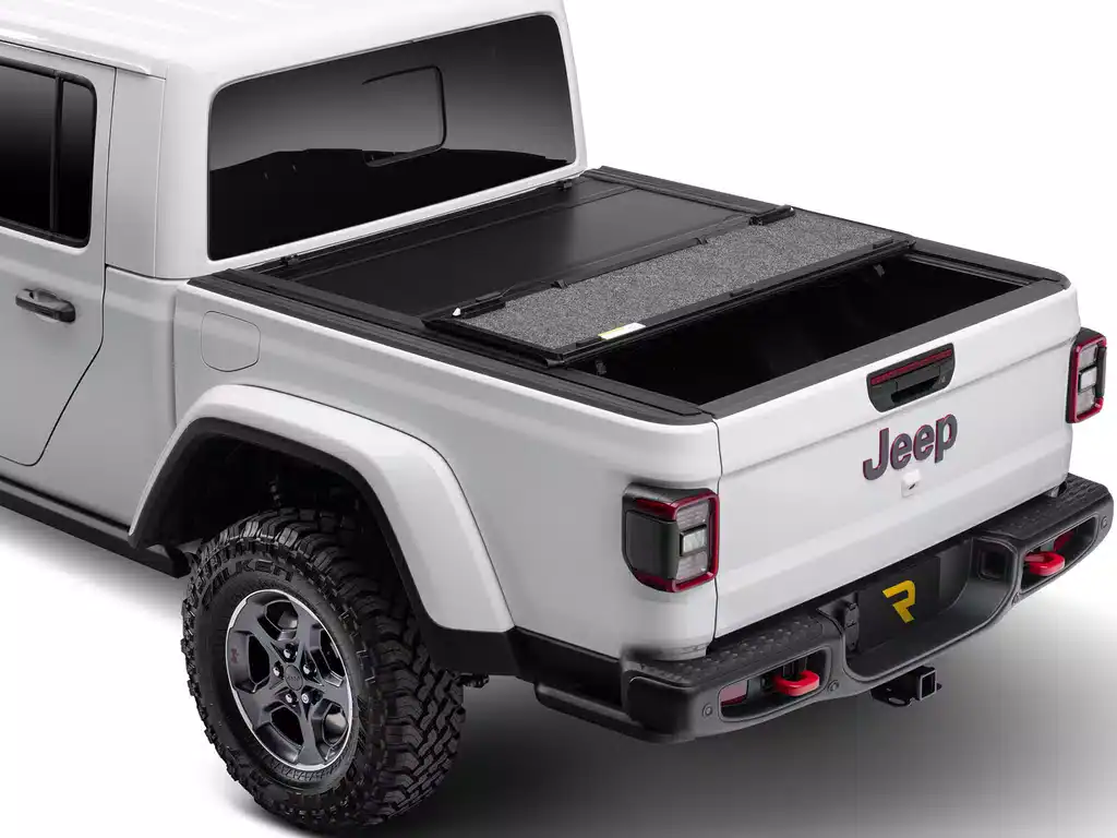 High-quality Jeep truck bed featuring a rugged bumper and secure cover, ideal for protecting cargo and enhancing vehicle durability.