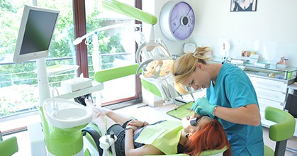Dentist examining a patient in a dental chair, dental X-rays in Leesburg VA