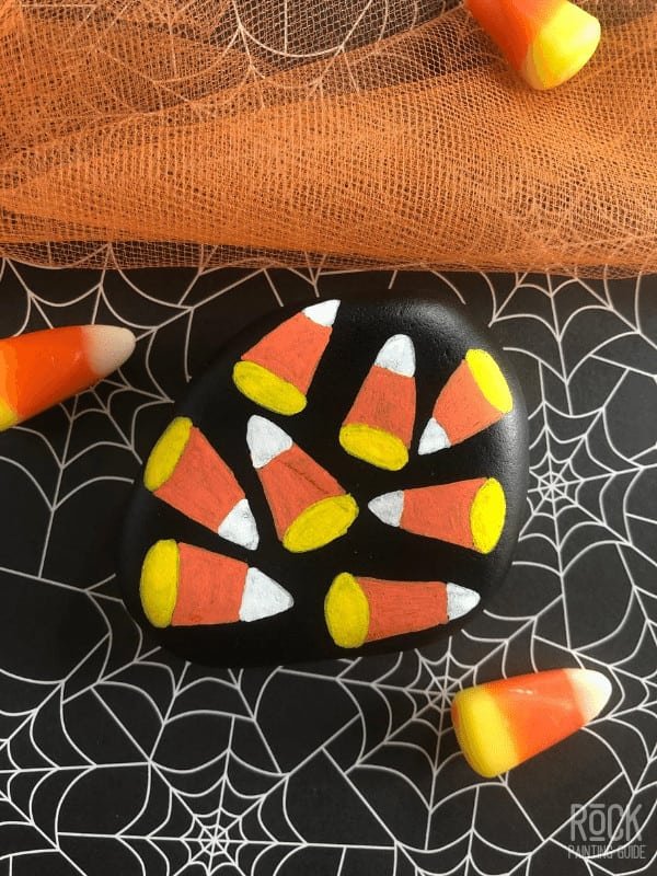 5 Easy Not So Scary Halloween Painted Rock Ideas 9 candy corns painted rock