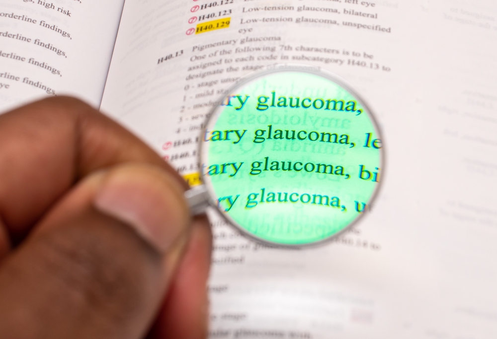 Man holding Magnifying glass Glaucoma Awareness Month