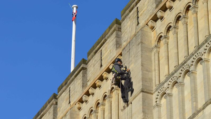 surveyor abseiling down norwich castle