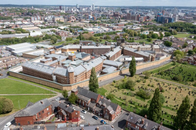 Aerial drone photo of the town of Armley in Leeds West Yorkshire in the UK, showing the famous HM Prison Leeds, or Armley Prison, showing the Jail walls from above on a sunny summers day.