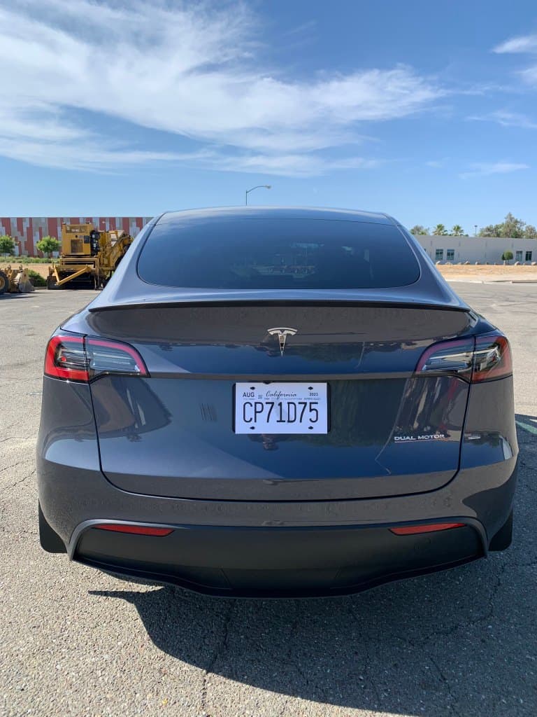 Tesla Model S with clean, shiny black exterior and tinted windows.