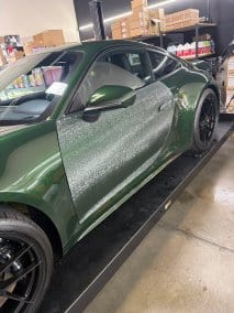 Green sports car with detailed paint correction at T1Detailing.