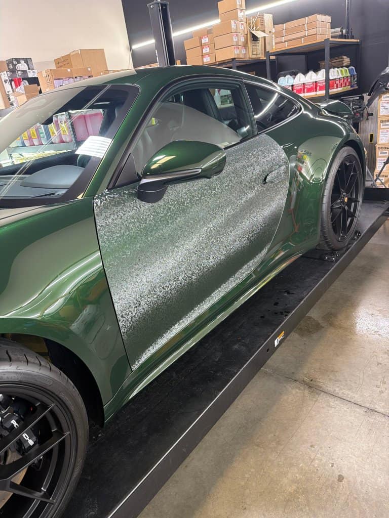 Green sports car with detailed paint correction at T1Detailing.