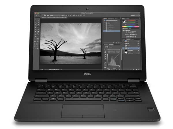 Image of a Dell laptop displaying photo editing software with black and white landscape.