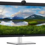 Οθόνη υπολογιστή Dell με ορεινό τοπίο και πράσινες πεδιάδες σε χαμηλή φωτισμένη σκηνή.