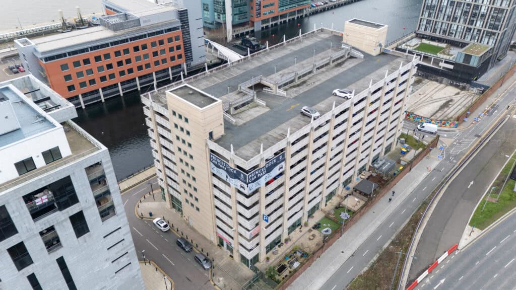 Multi-storey car park at Holyrood Nursery Princes Dock, Leeds, with surrounding buildings and roadways.