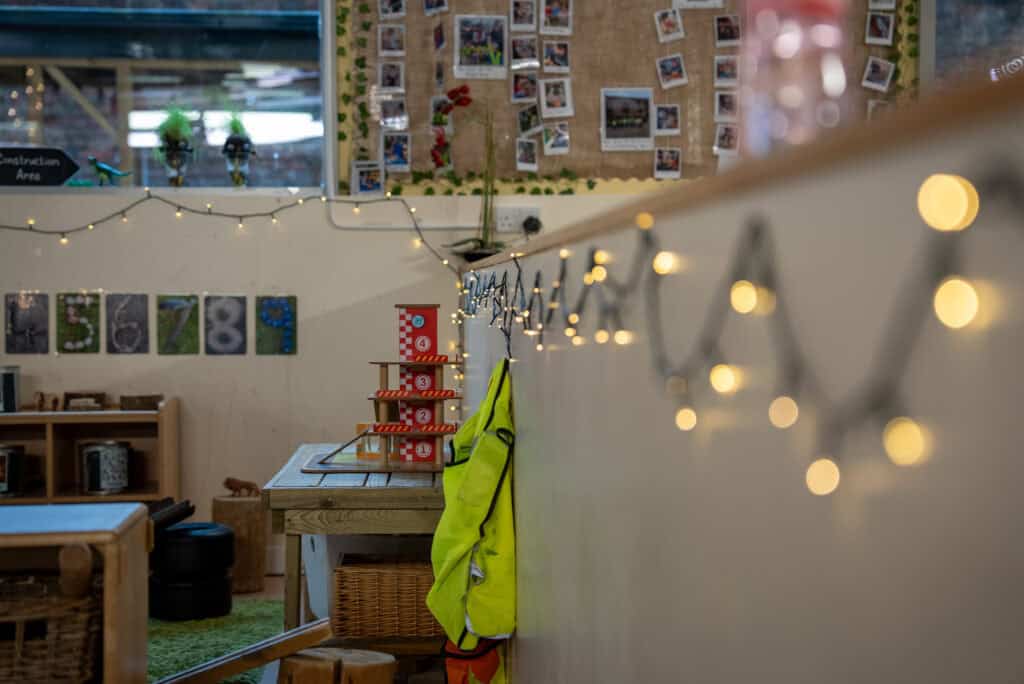 Bright and welcoming nursery classroom at Holyrood Nursery Princes Dock, featuring colourful decorations, educational toys, and a cosy environment designed for early childhood development.