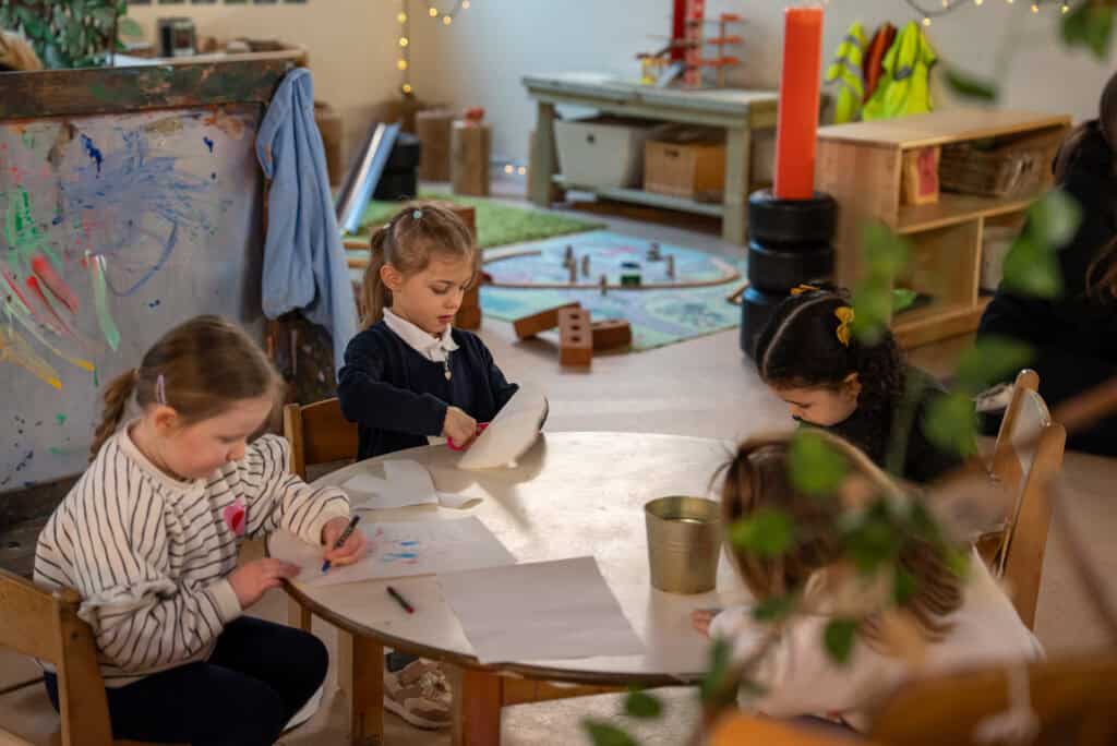 Children engaging in creative activities at Thrive Childcare nursery in Holyrood, Princes Dock, fostering early learning and development.