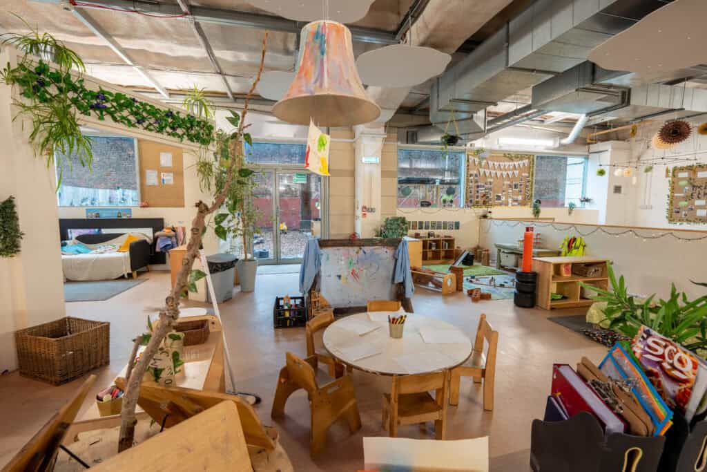 Colourful, engaging nursery space with toys, furniture, and natural light, fostering creativity and exploration.