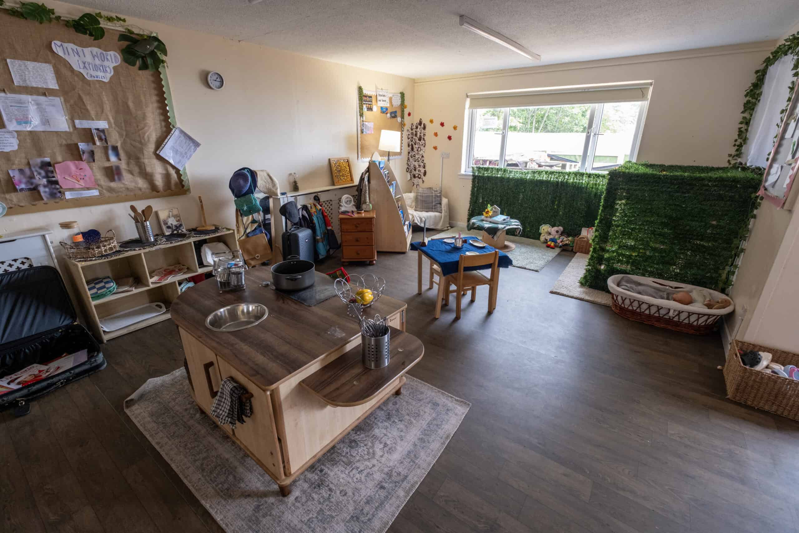 Bright and welcoming childcare room at Thrive Childcare with play areas, child-sized furniture, and educational turns, designed to support early development and learning for young children.
