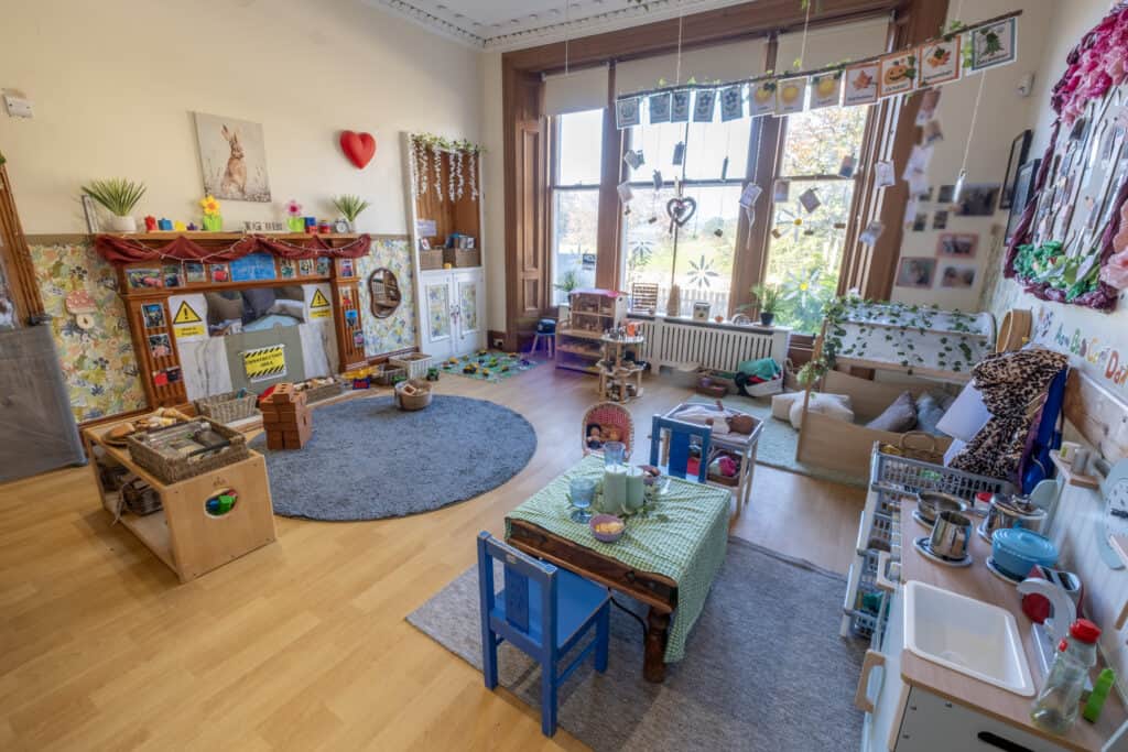 Bright and welcoming childcare room at Thrive Childcare with toys, activity areas, and colourful decorations designed for early childhood learning and development.