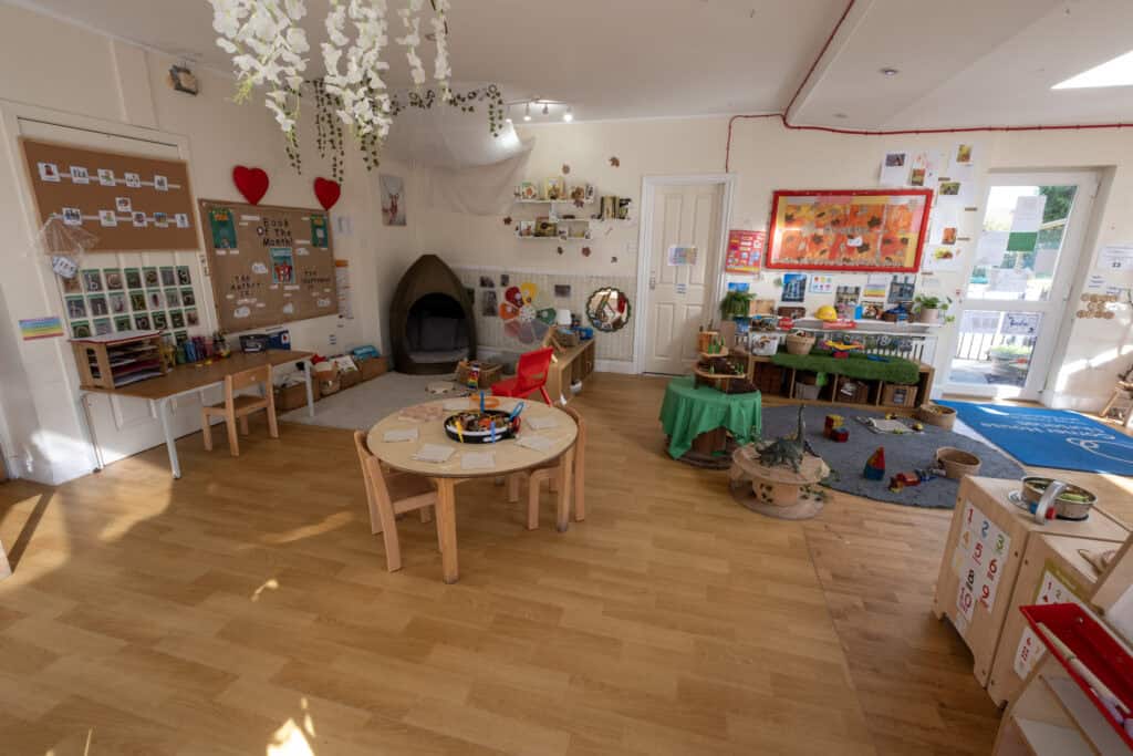 Bright and inviting childcare playroom with educational toys, reading corners, and creative activities, designed to foster early learning and development at Thrive Childcare.