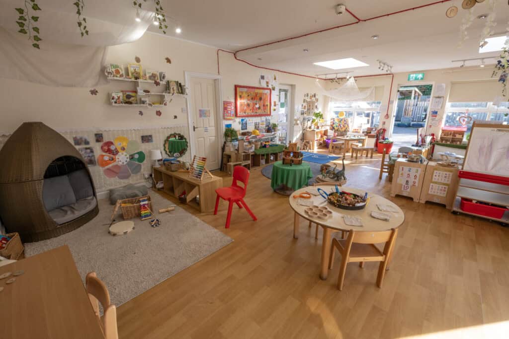 Bright and welcoming indoor childcare environment at Thrive Childcare featuring colourful toys, play areas, and educational materials designed to promote early childhood development and learning.