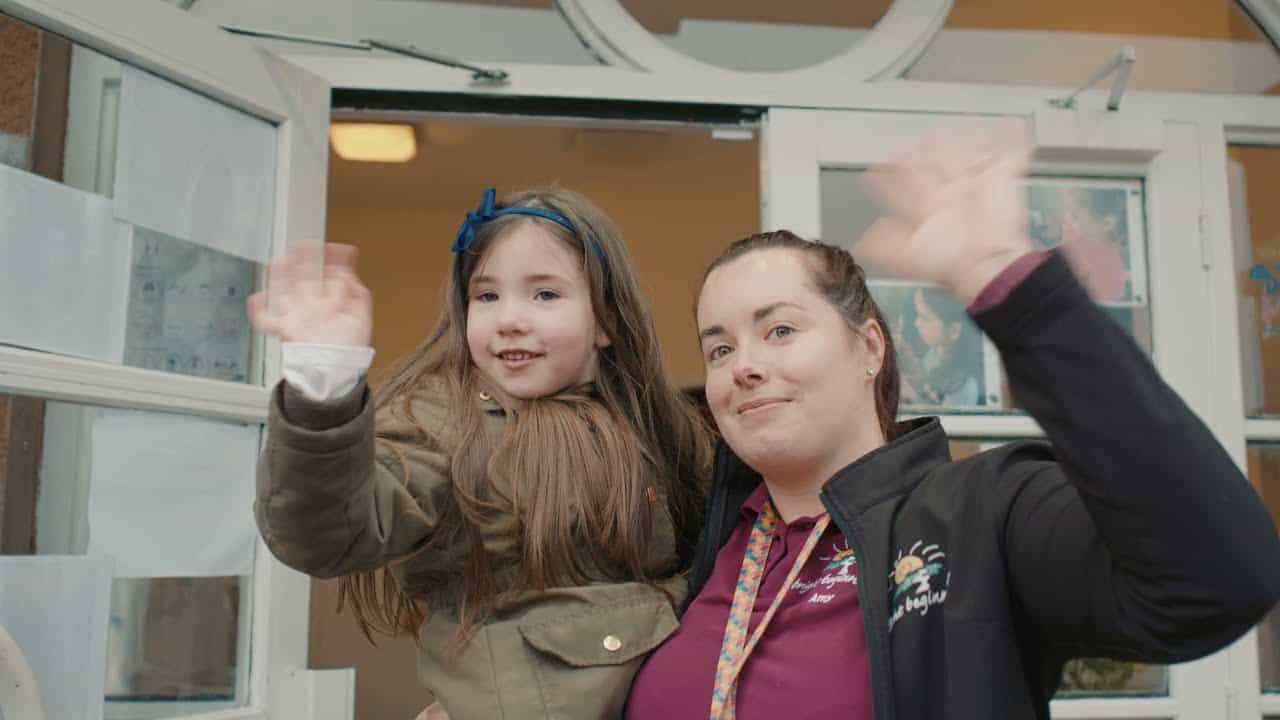 1. Happy child with staff at Thrive Childcare centre, engaging in fun activities, providing a nurturing environment for early childhood development in the UK.