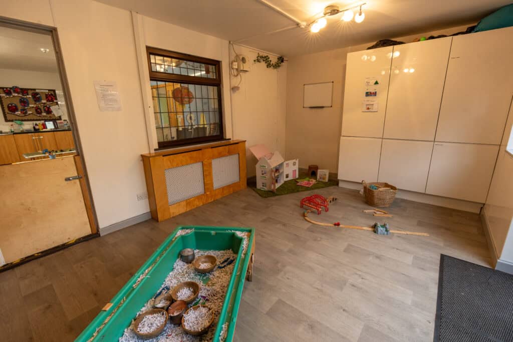 Indoor play area at Thrive Grosvenor House childcare centre, featuring soft mats, toys, and engaging activities for children’s development and fun.