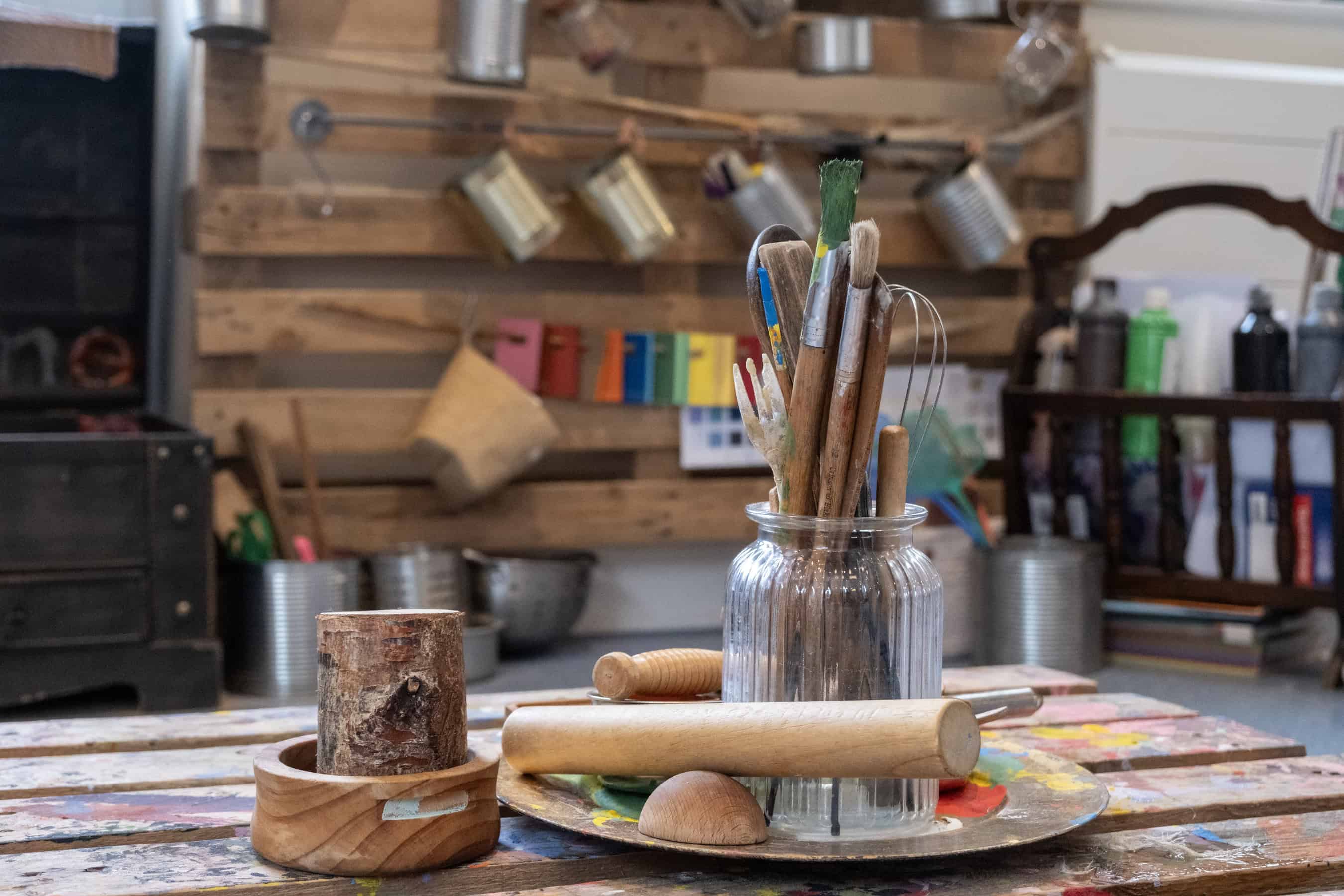 Bright children's arts and crafts supplies in a colourful, creative toddler activity area at Thrive Childcare centre.