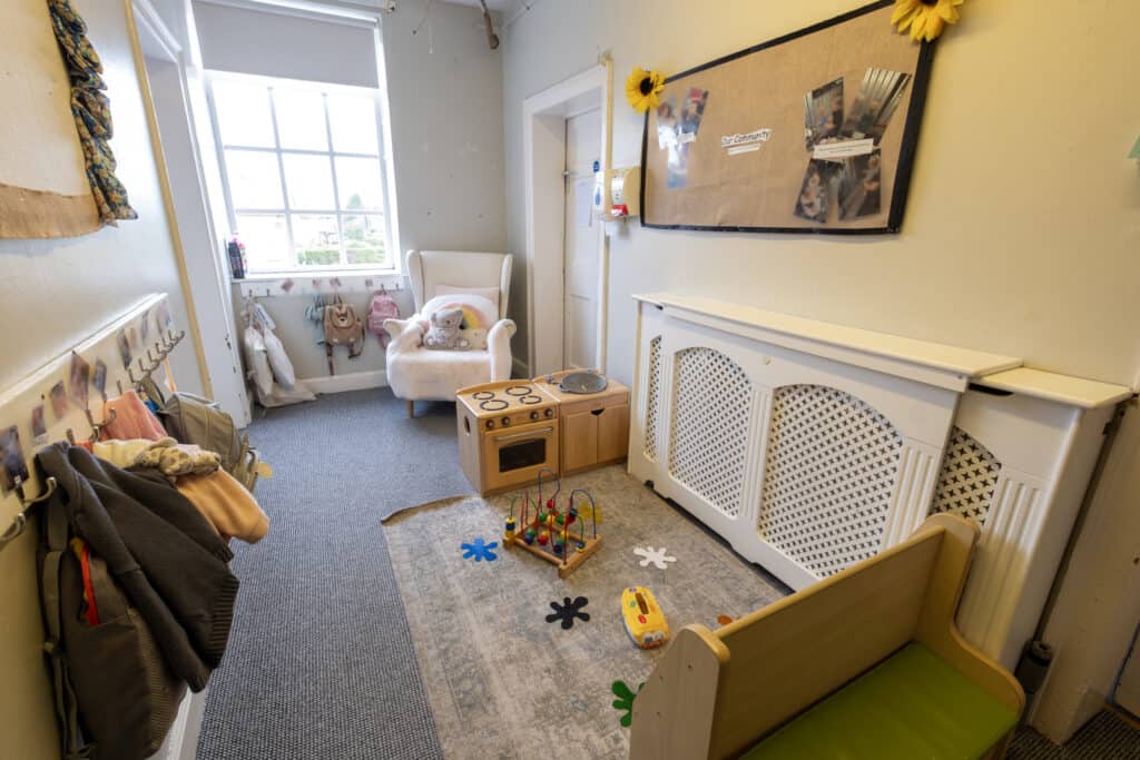 Soft Pastel Nursery Room at Thrive Childcare, featuring age-appropriate toys, cosy seating, and a safe environment for young children’s early learning and development.