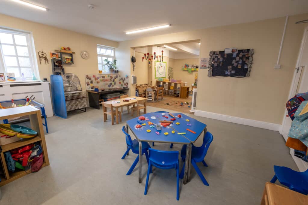 Bright and spacious childcare indoor play area at Thrive Childcare, featuring colourful toys, educational activities, and a safe environment for early childhood development and learning.