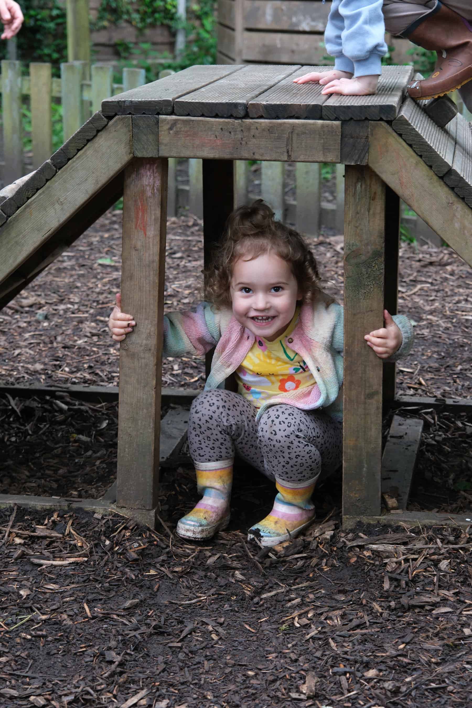 1. Children playing outdoors at Thrive Childcare, enjoying safe and engaging playground activities for early childhood development.