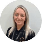 Bright, cheerful childcare professional smiling in a modern nursery setting, promoting trust and quality care at Thrive Childcare.