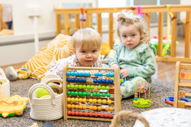 Counting and learning with children at Thrive Childcare, a safe and nurturing environment for early childhood development in the UK.