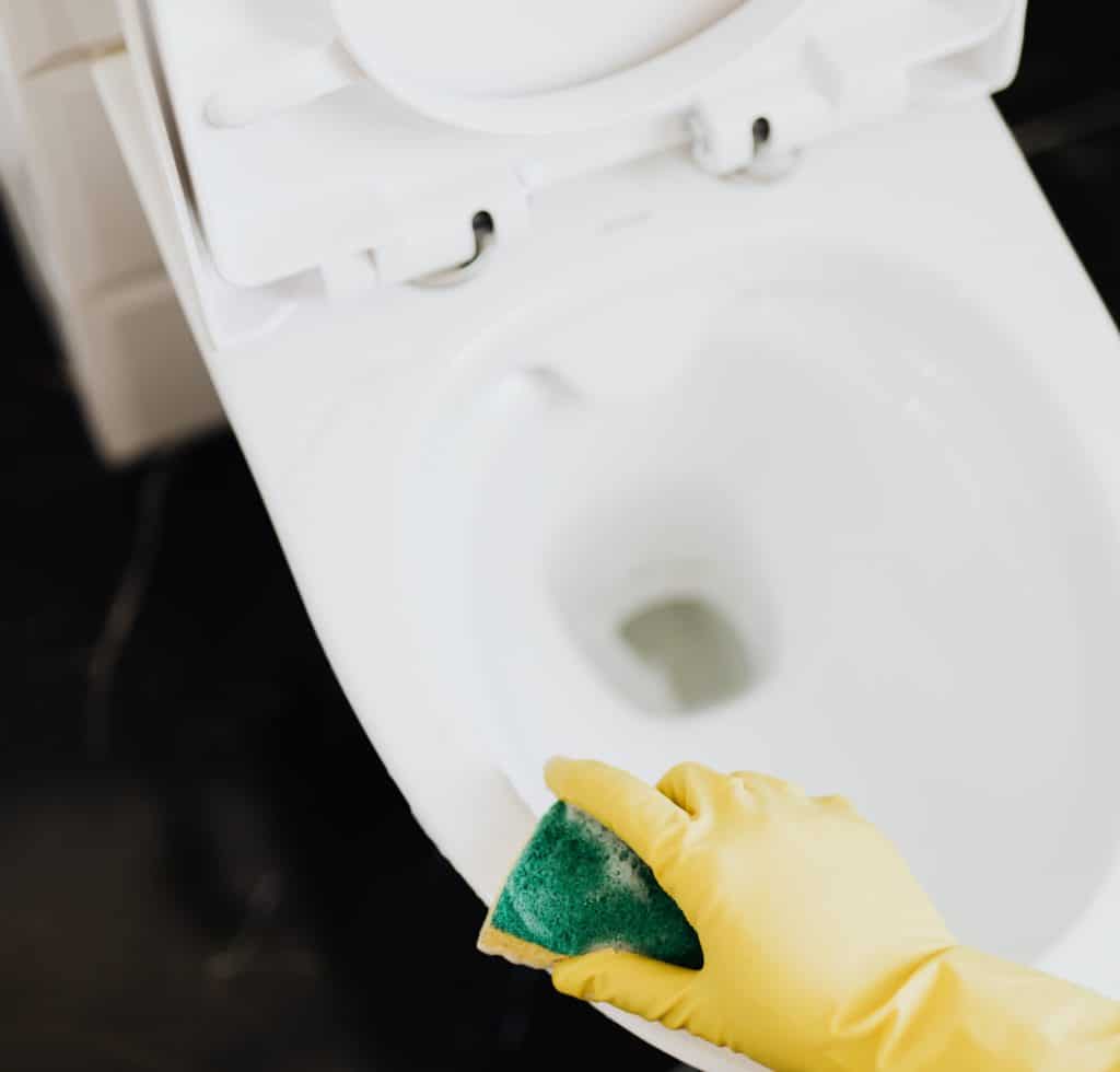 pexels-karolina-grabowska-4239072 - Upstairs Downstairs Cleaning Service cleaning and scrubbing toilet