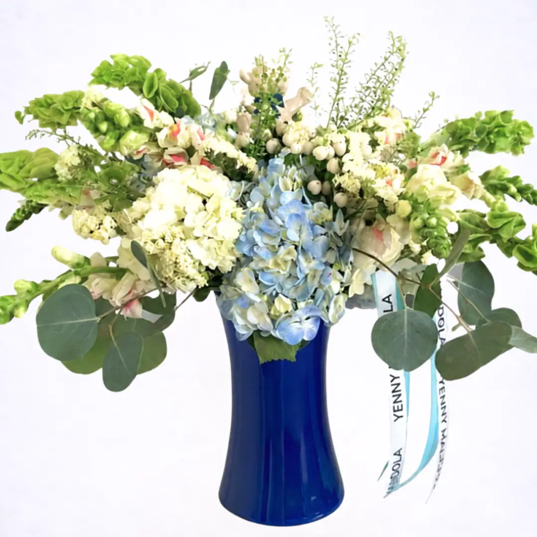 Luxury blue hydrangea flower arrangement in cobalt blue vase