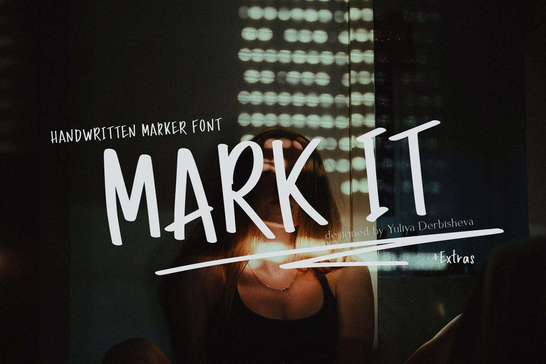 Handwritten marker font logo for 'MARK IT' with city lights background.