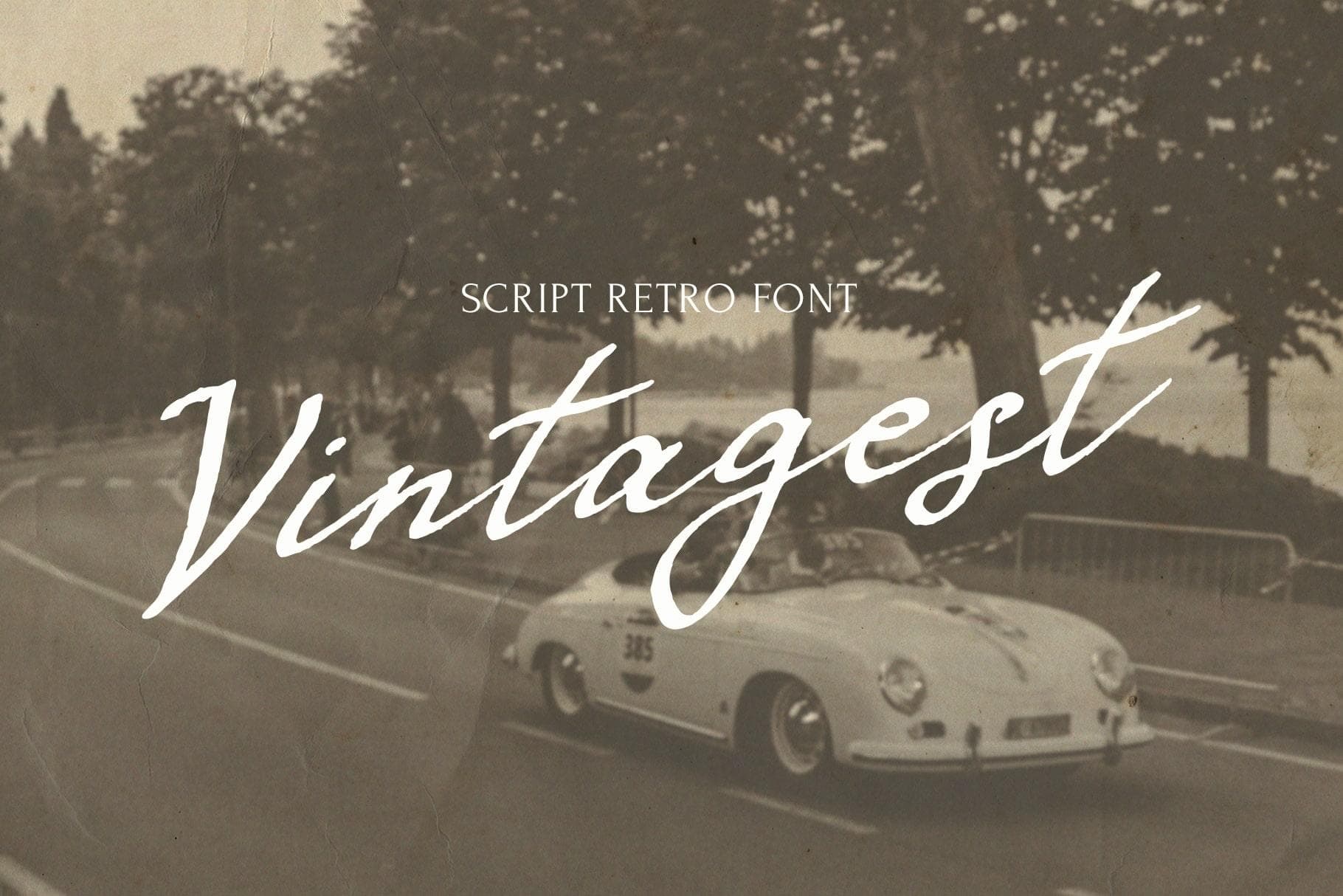 Vintage retro script font with classic car and trees background.