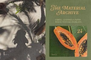 Close-up of papaya fruit with black seeds on green leaf background.