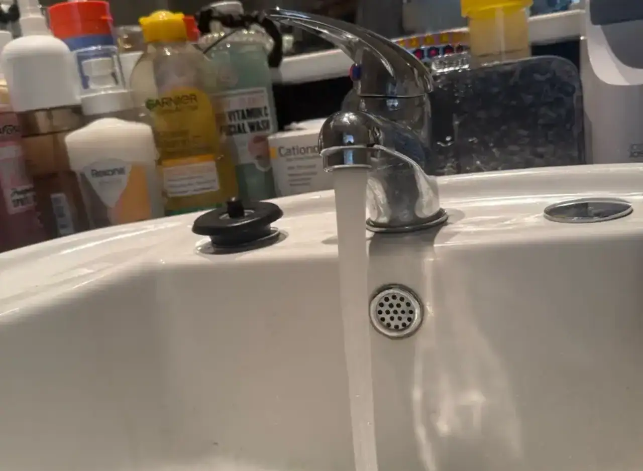 Replacement of basin waste trap for plumbing repair in Richmond. Expert plumbing services by Zebra P.