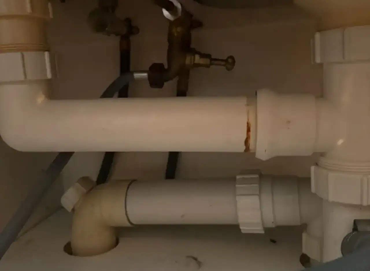 Replacement of basin waste trap for plumbing repair in Richmond. Expert plumbing services for effici.