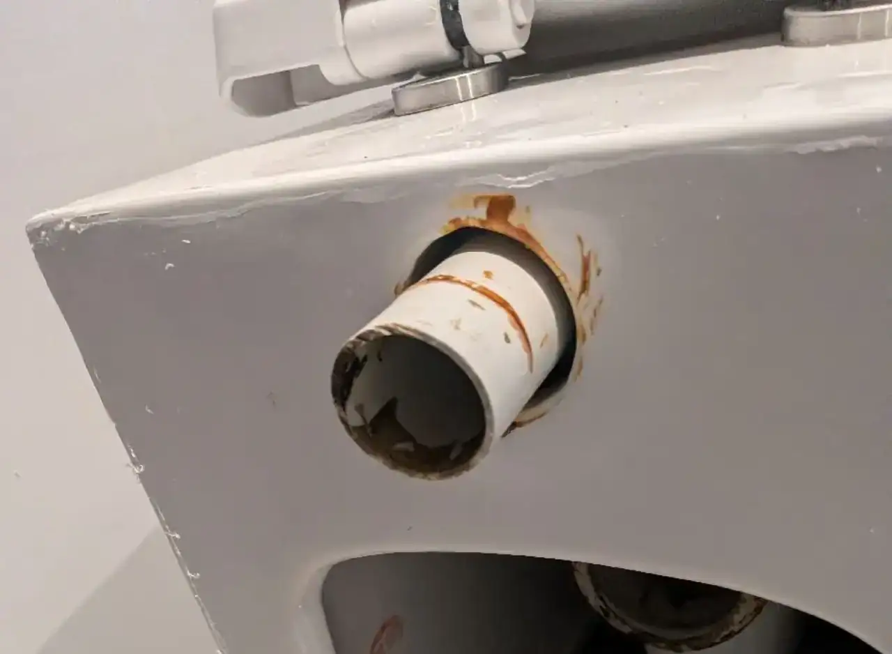 Toilet base leak causing water damage, fixed by professional plumbers in Richmond.