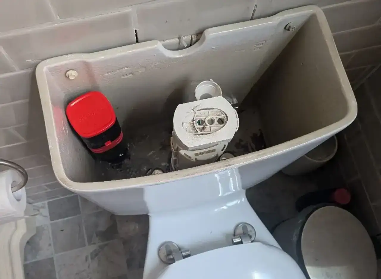 Toilet tank with new fill valve and flush mechanism installed in South Yarra. Expert plumbing servic.
