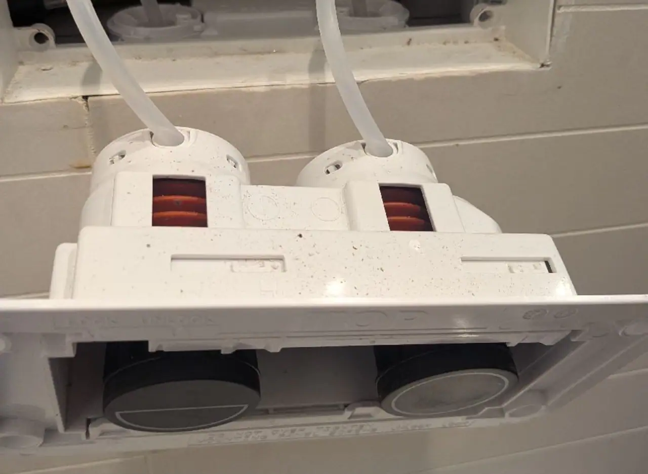 Dual power outlets with safety covers for electrical safety.