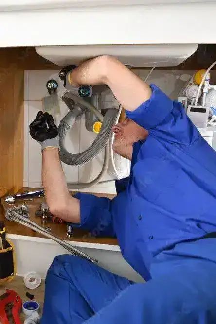 A licensed plumber performing a clean and respectful repair on a Keysborough household drainage system to restore full water flow.