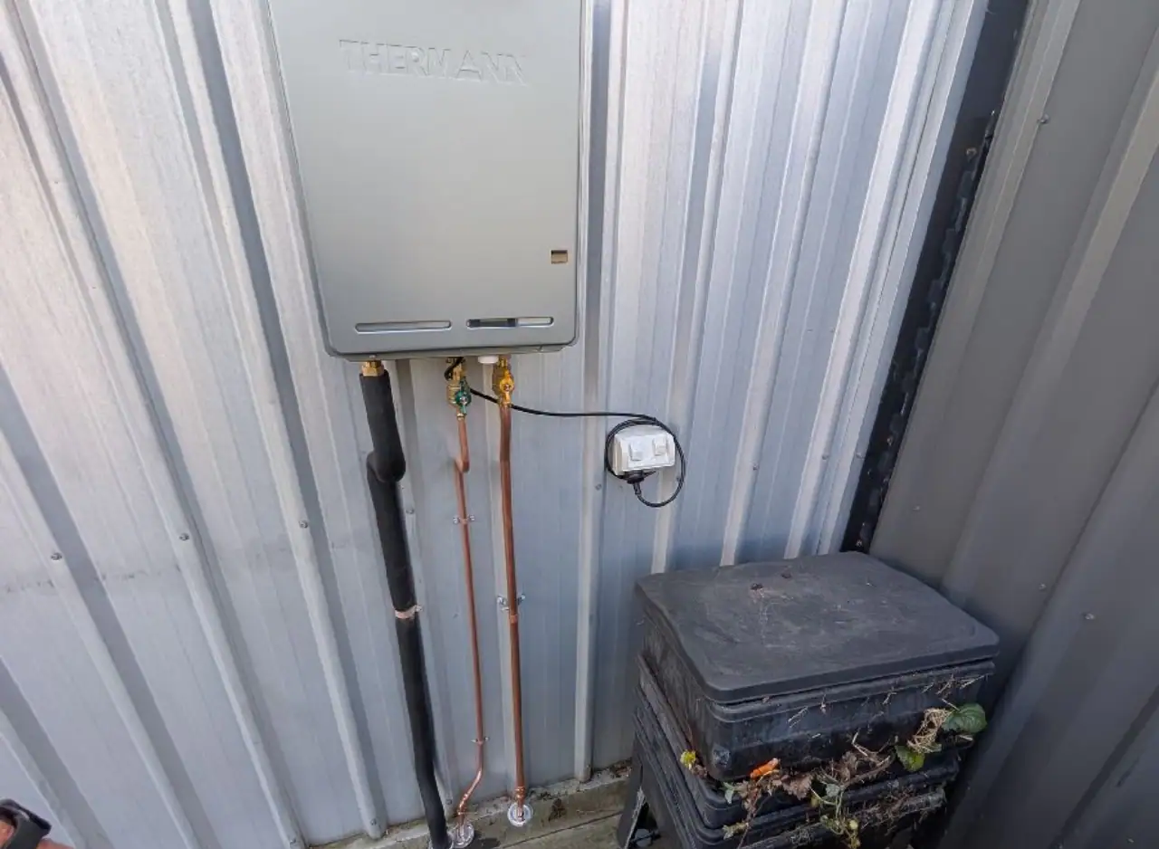 Gas hot water system installed on exterior wall in Richmond.