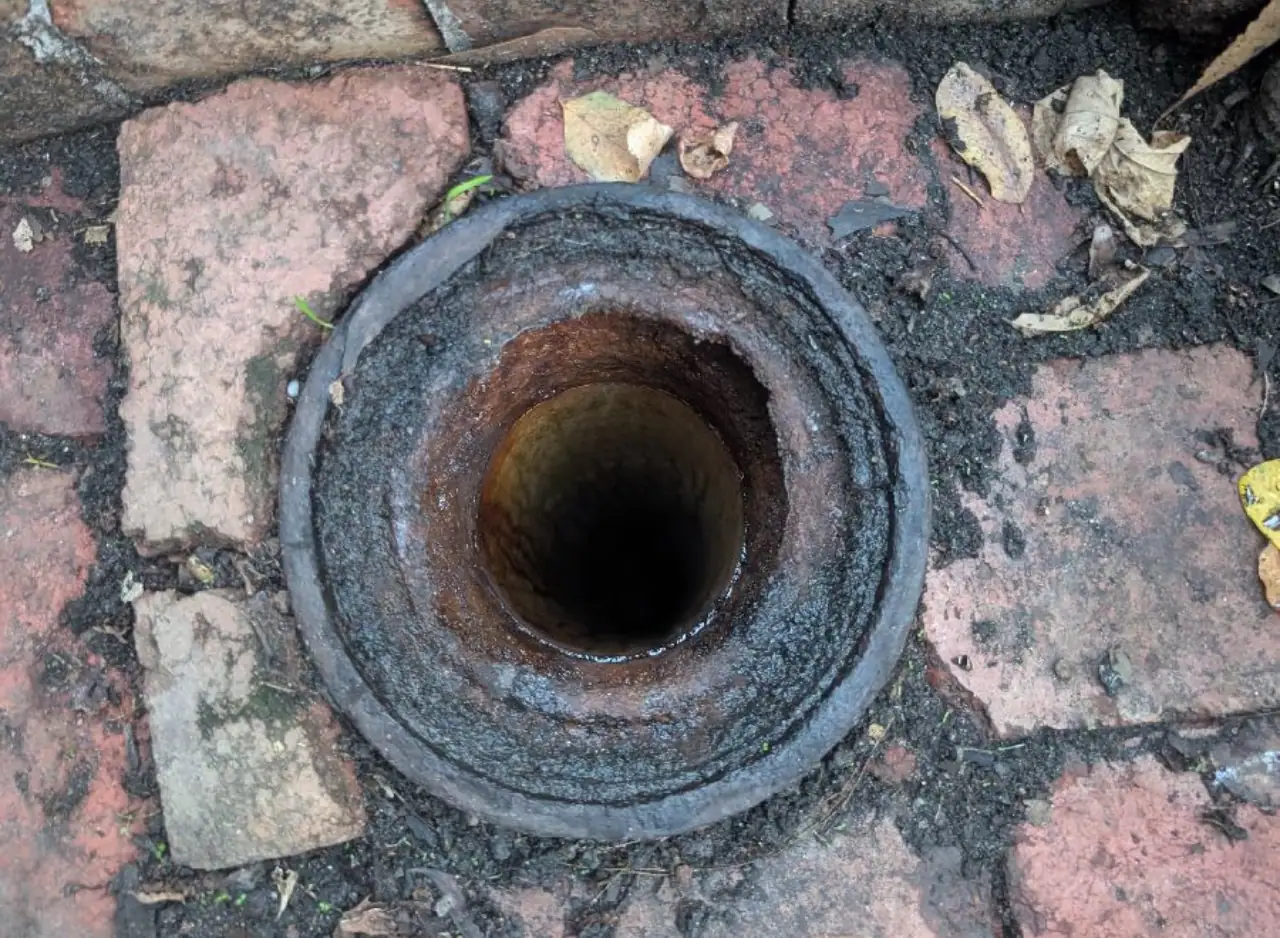 Open drain pipe showing blockage and debris in Hawthorn.