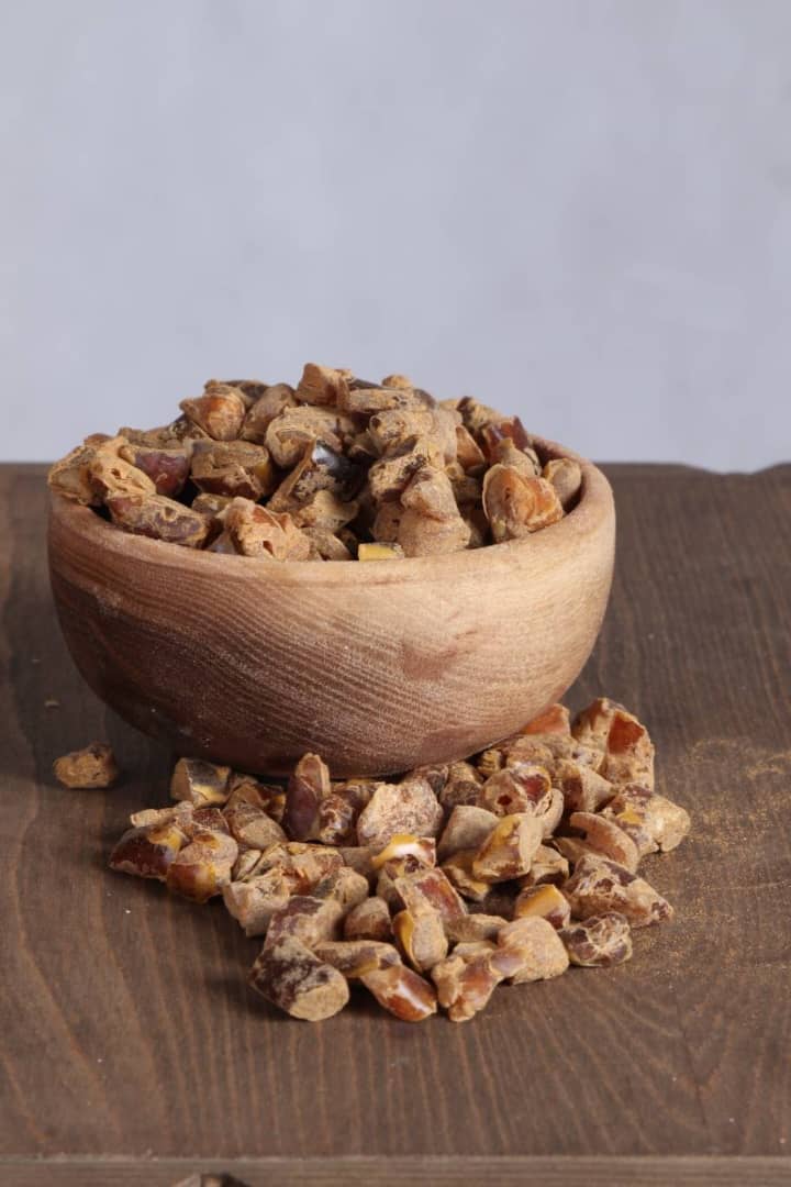 Cinnamon flavored chopped dates in a wooden bowl